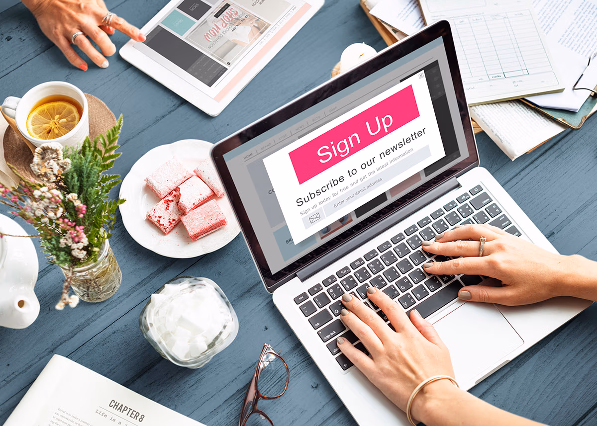 Email marketing: an image showing a laptop with a "Sign Up, Subscribe to our Newsletter" pop-up.