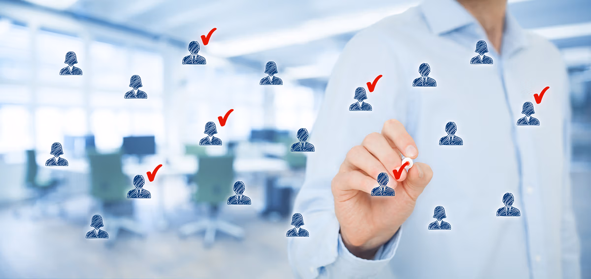 finding your target audience: a creative representation of a person checking target customers with a red ink