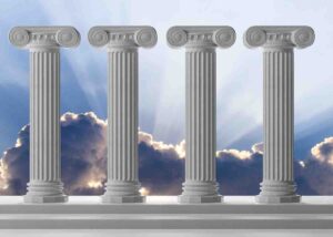 four marble pillars in blue sky background