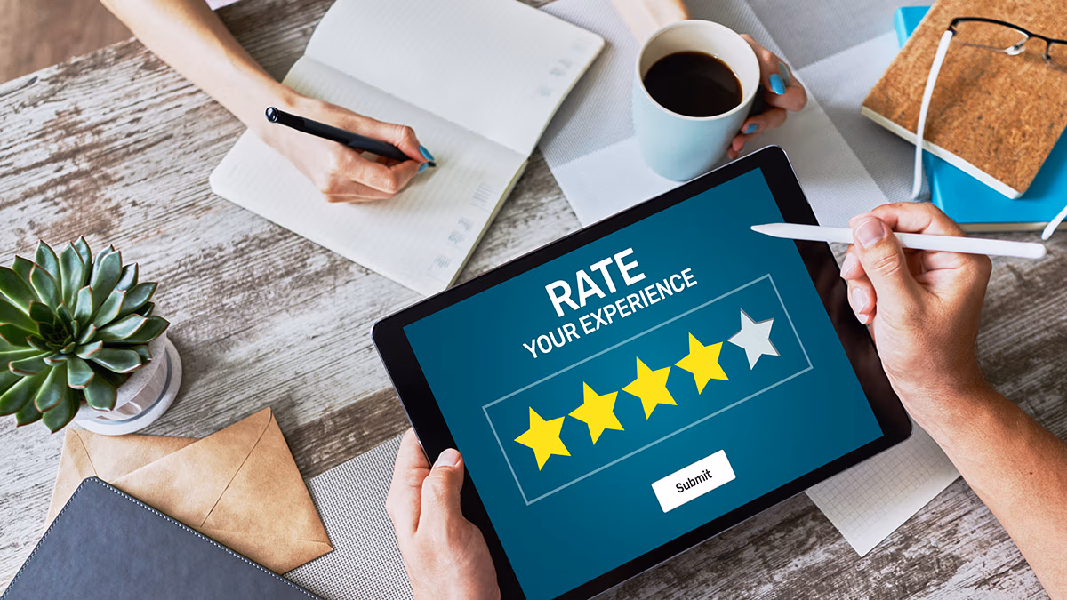 online reviews: a photo showing a person holding a mobile device to give 4 stars customer experience review