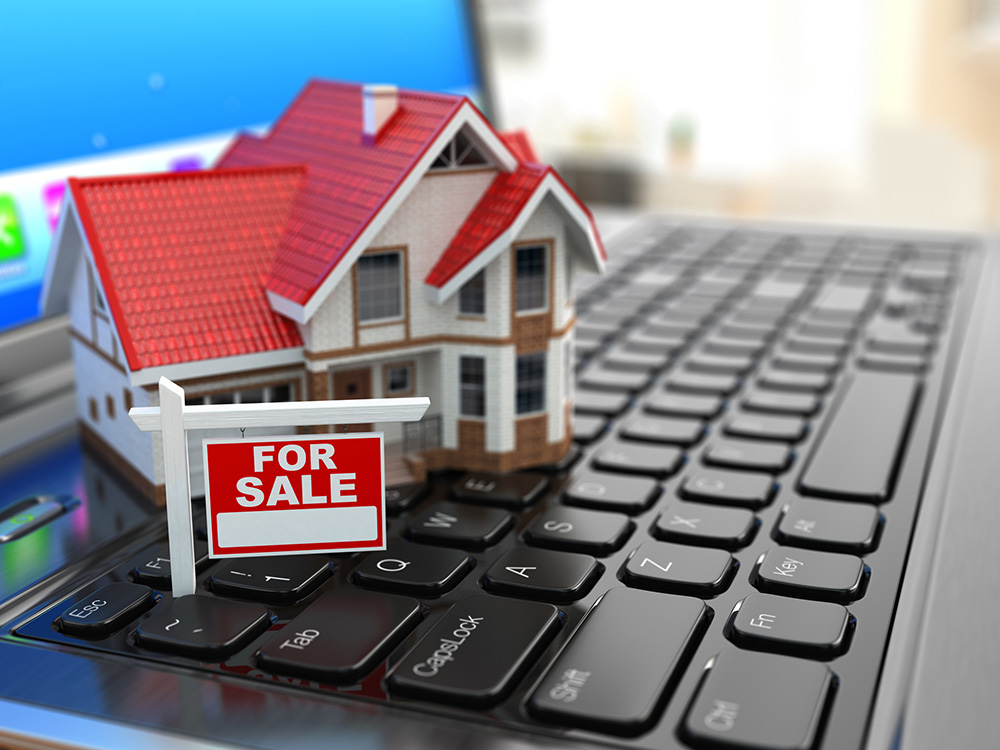 Real Estate lead generation: a house miniature placed on a laptop