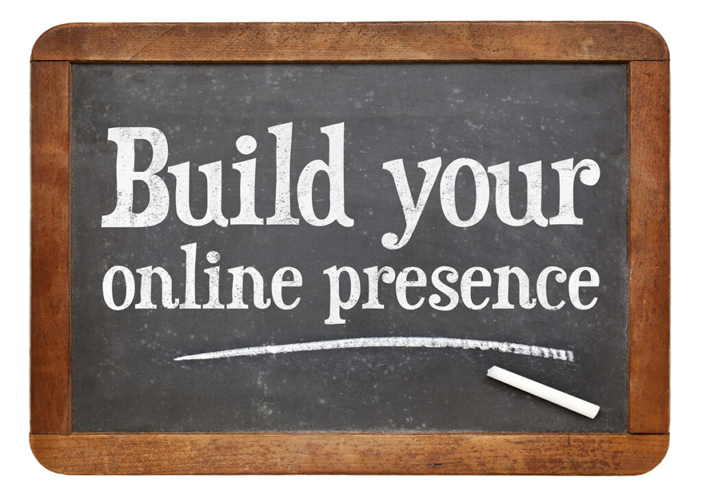 The sentence "Build your online presence" written on a chalkboard.