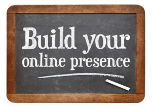 The sentence "Build your online presence" written on a chalkboard.