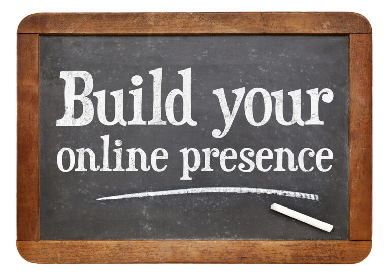 The sentence "Build your online presence" written on a chalkboard.