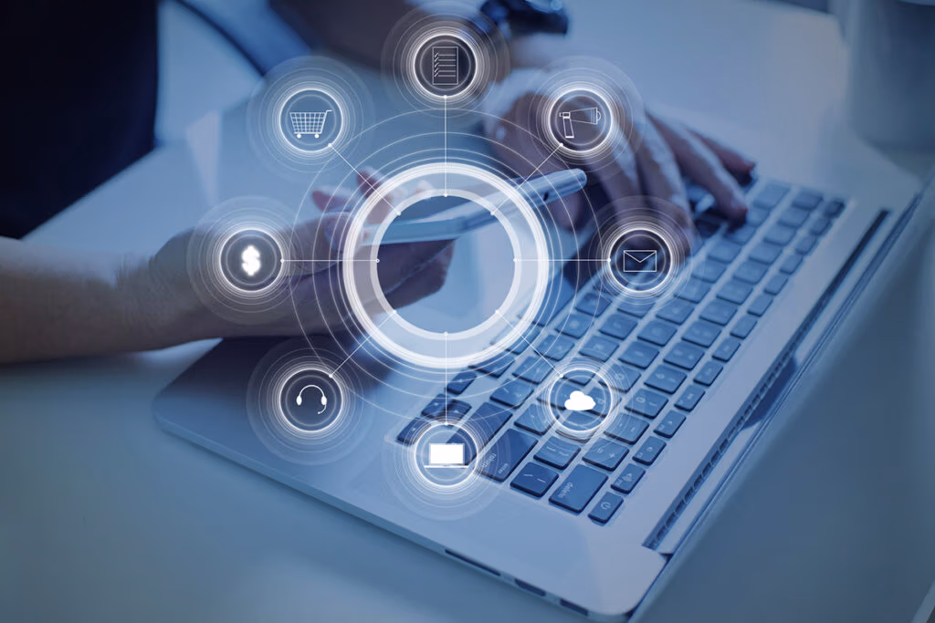 a creative representation of advertising target: a person holding a smart phone in front of a laptop.