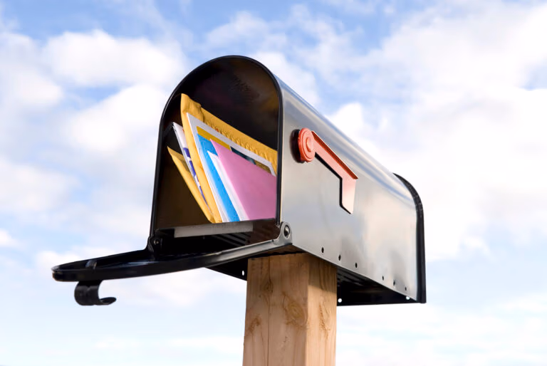 Direct mail marketing: an image of open mailbox with mail inside.