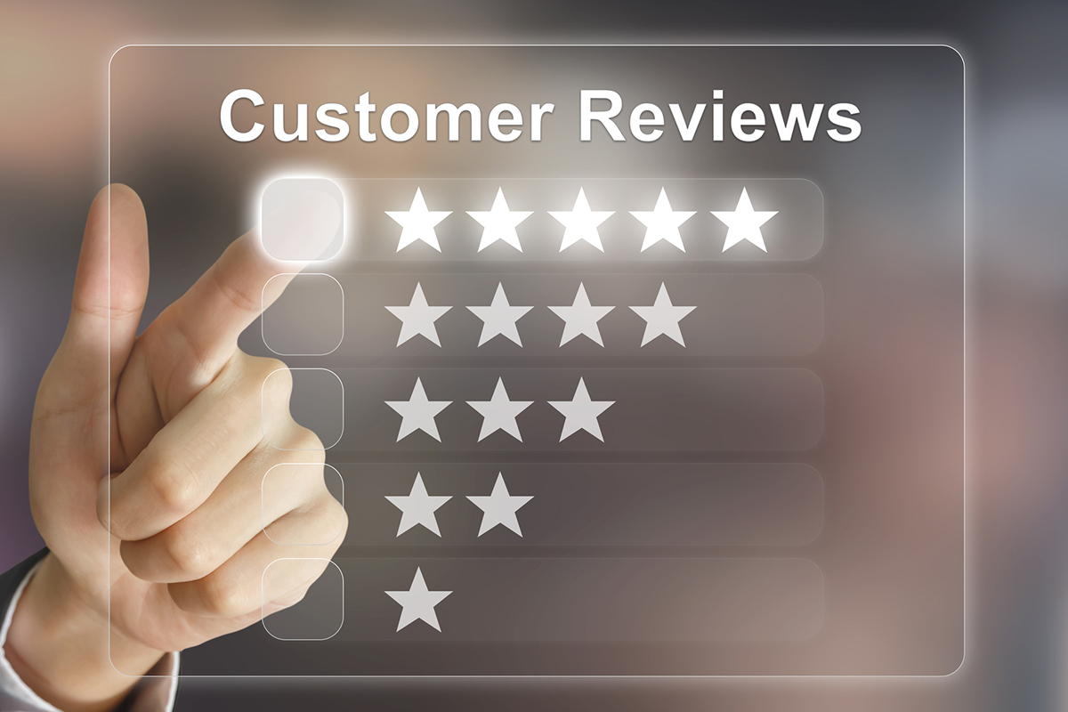 Customer reviews: a hand tapping a glowing silver five-star review option.
