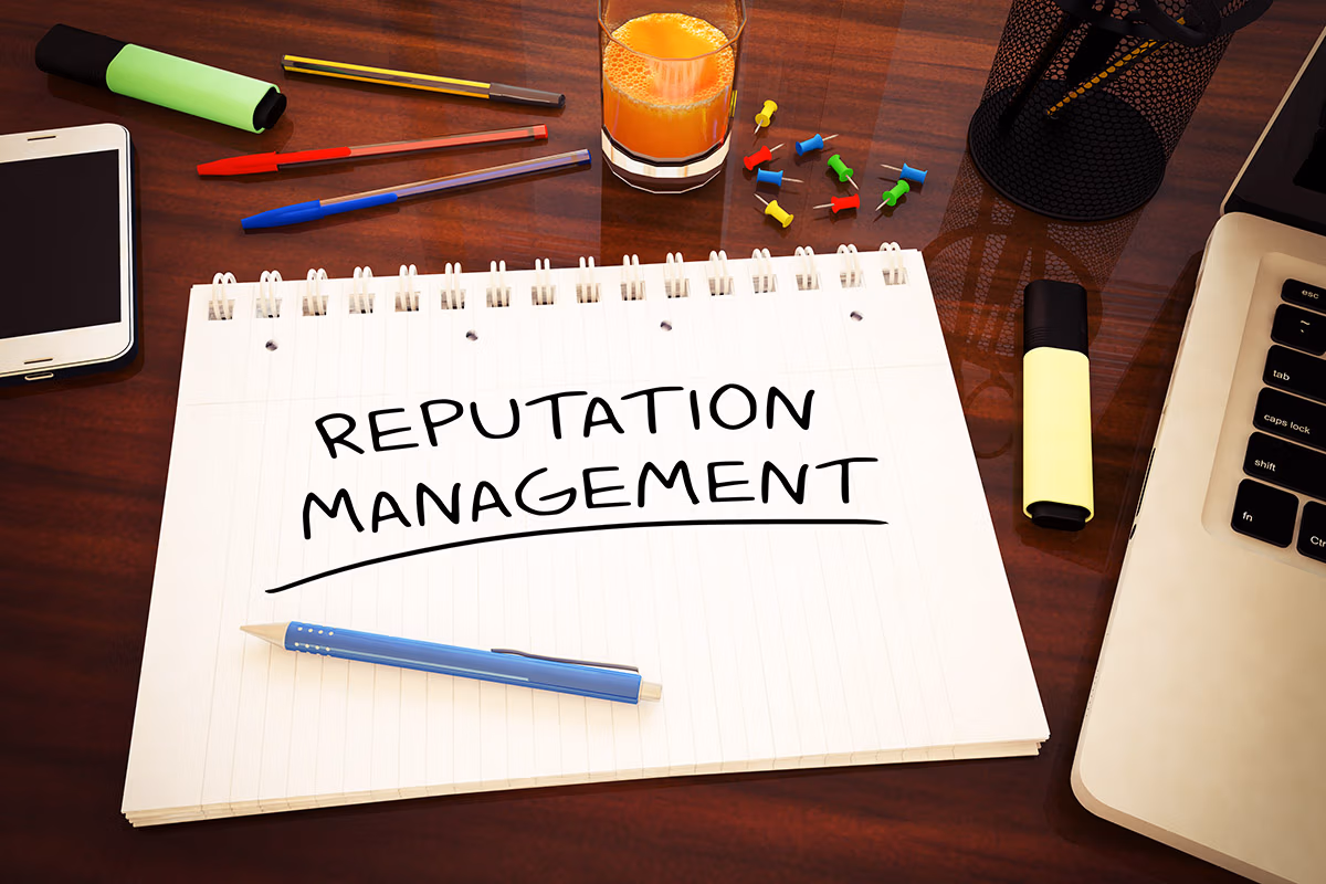 Plastic surgeon SEO and doctor reputation. The phrase "reputation management" is written in a notepad on top of a table.