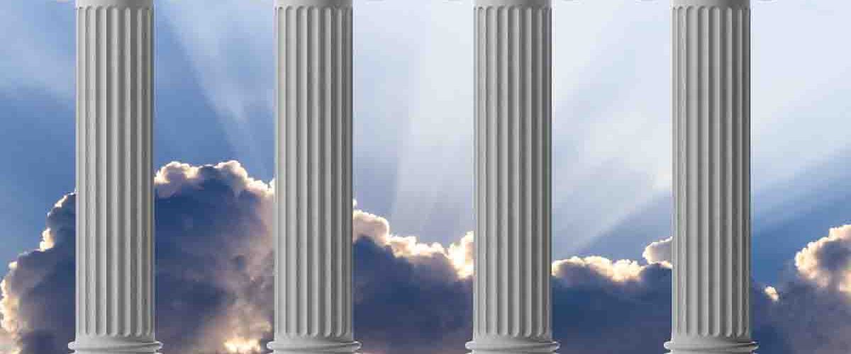 four marble pillars in blue sky background