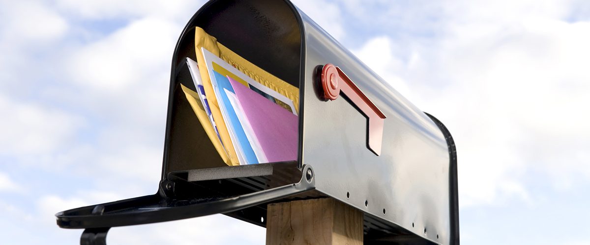 Direct mail marketing: an image of open mailbox with mail inside.