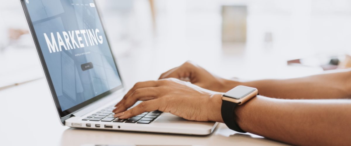 hands on a laptop