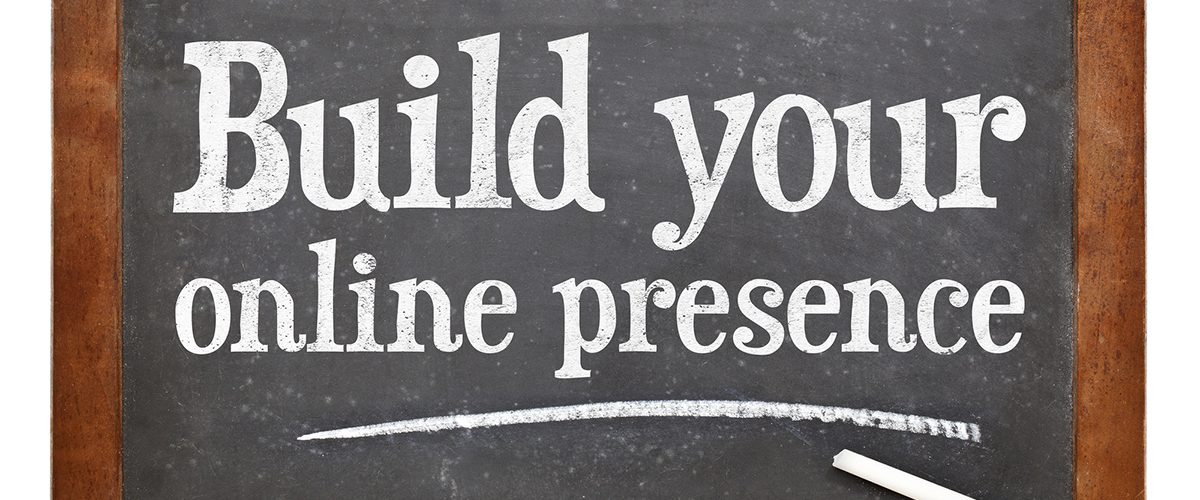 The sentence "Build your online presence" written on a chalkboard.