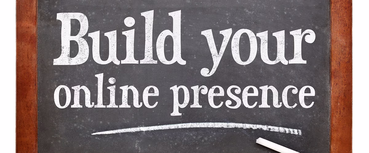 The sentence "Build your online presence" written on a chalkboard.